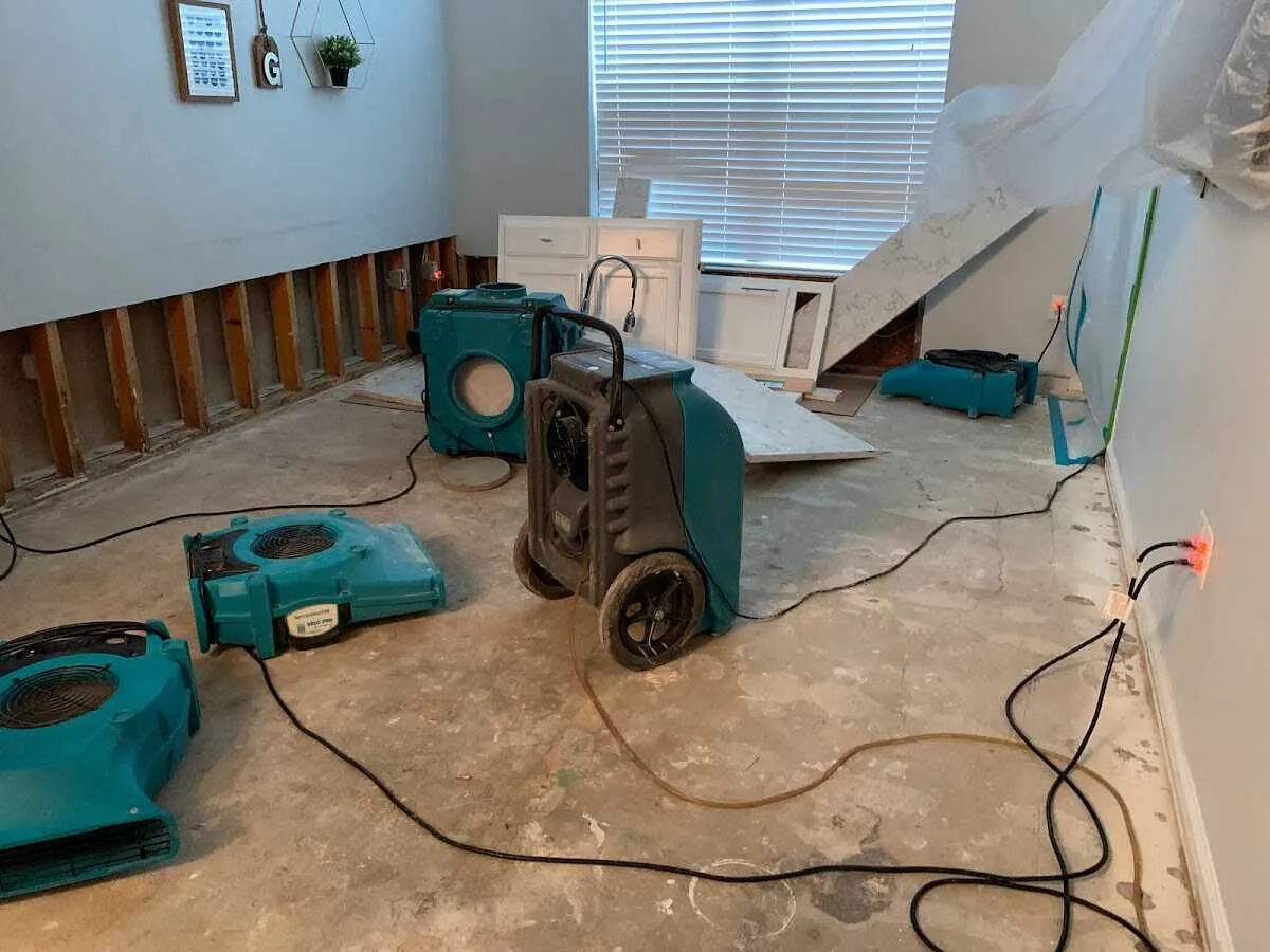 Dehumidifier in flood-cut room for Water Damage Restoration in Fort Lupton